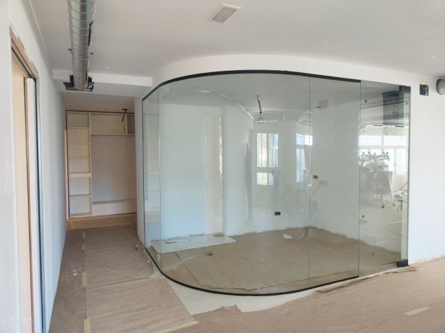 Curved glass office